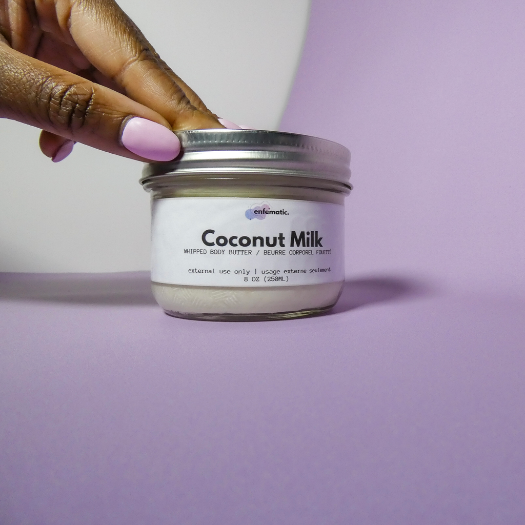 coconut milk behind a purple and white background